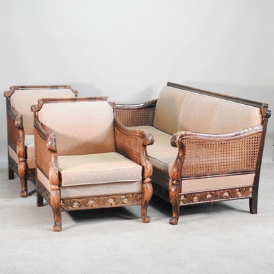 Lot 422 - A 1920s walnut double cane three piece bergere...