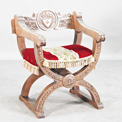 Lot 58 - A mid 20th century x-frame armchair, with an...