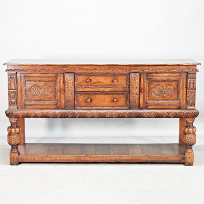 Lot 28 - An oak dresser base, by Titchmarsh & Goodwin,...