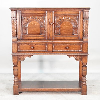 Lot 32 - An oak side cabinet, by Titchmarsh & Goodwin,...