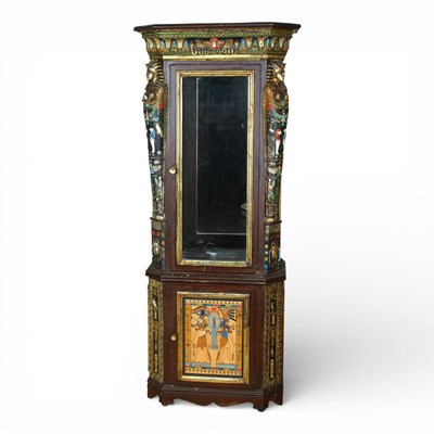 Lot 318 - An Egyptian revival display cabinet, decorated...