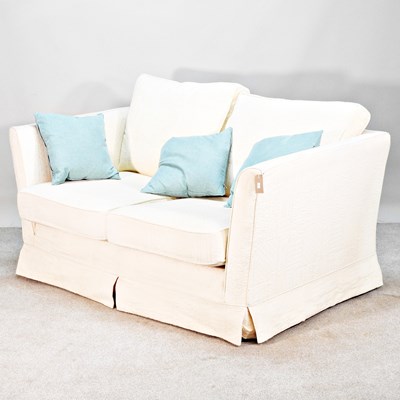 Lot 150 - A modern cream upholstered sofa, with loose...