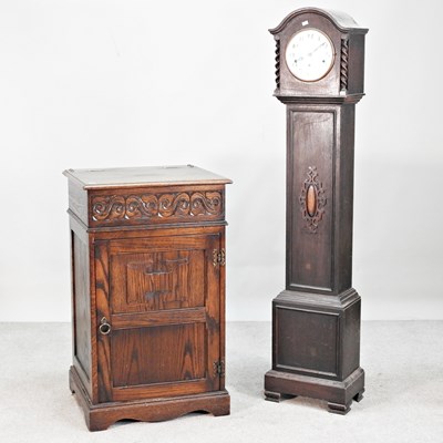 Lot 353 - A 1920s oak cased granddaughter clock,...