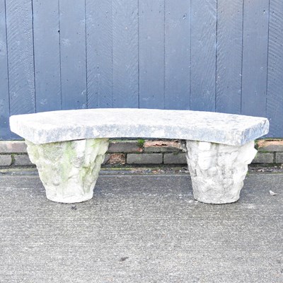 Lot 162 - A cast stone garden bench, of curved shape,...