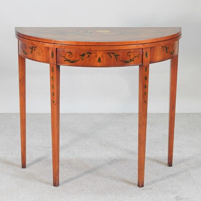 Lot 587 - A George III style satinwood folding card...