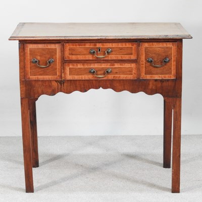 Lot 512 - An 18th century fruitwood and inlaid lowboy,...