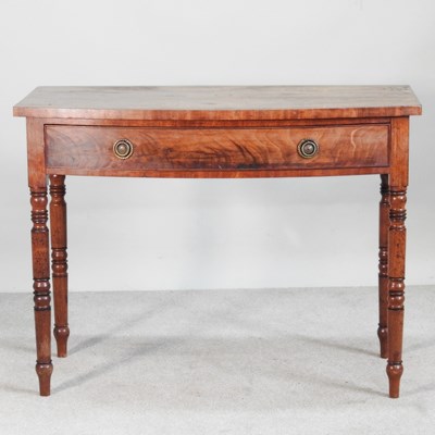 Lot 301 - A Regency mahogany bow front side table, with...