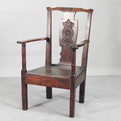 Lot 634 - A George III elbow chair, with a carved back