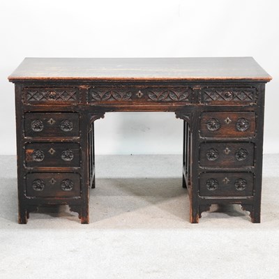 Lot 501 - An early 20th century dark oak pedestal desk,...