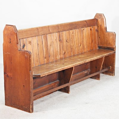 Lot 22 - An early 20th century pine church pew, with a...