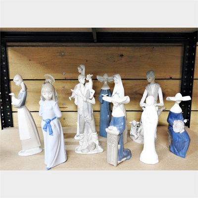 Lot 380 - A collection of Lladro and Nao figures and others