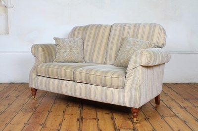 Lot 495 - A modern striped two seater sofa