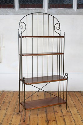 Lot 488 - A wrought iron and wood baker's rack of shelves