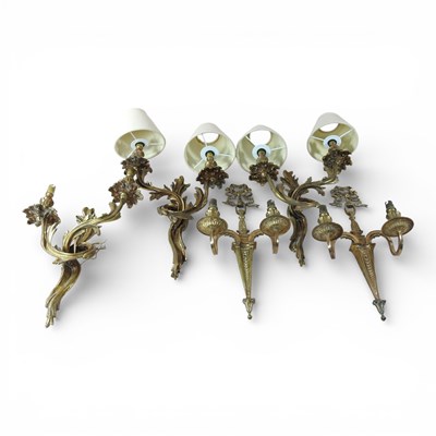 Lot 306 - A set of three brass Rococo style wall sconces,...