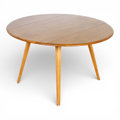 Lot 613 - An Ercol blonde elm drop leaf dining table