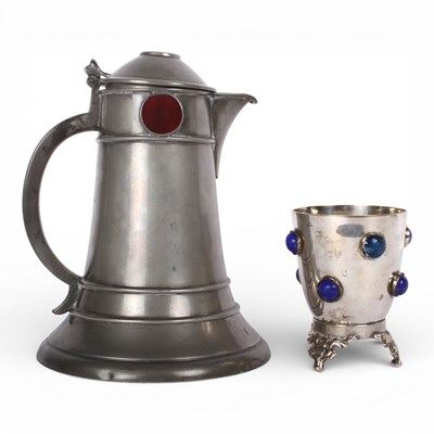 Lot 90 - An Arts and Crafts pewter jug with red...