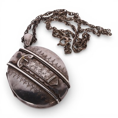 Lot 63 - A Victorian silver locket, relief decorated...