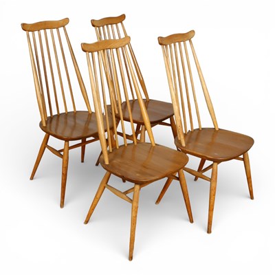 Lot 607 - A set of four Ercol blonde elm stick back...
