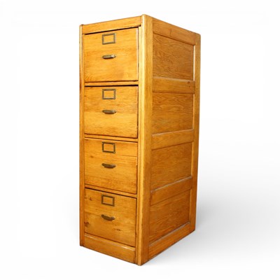 Lot 147 - An early 20th century oak filing cabinet