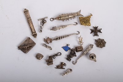 Lot 83 - A collection of twenty-two silver charms and...