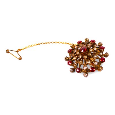 Lot 7 - An ornate ruby and diamond brooch, of tiered...