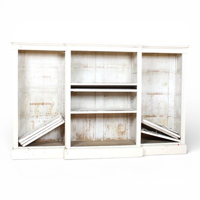 Lot 610 - A white painted breakfront open bookcase,...