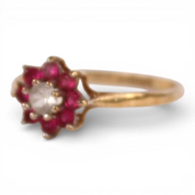 Lot 59 - A 9 carat yellow gold red gem set cluster ring,...