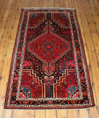 Lot 253 - A 20th century wool Mahal rug, red ground, 255...