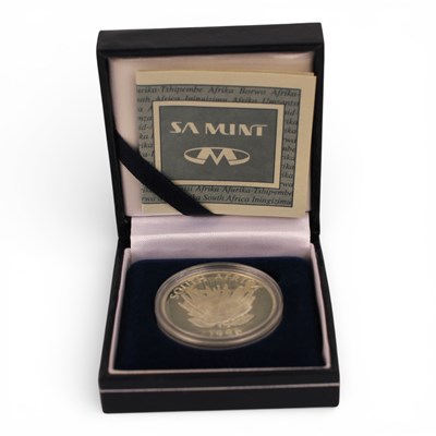 Lot 114 - A 1996 South African silver Protea one rand...