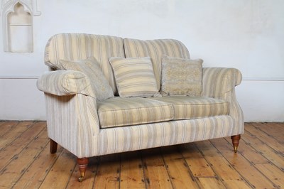 Lot 484 - A modern striped upholstered two seater sofa,...