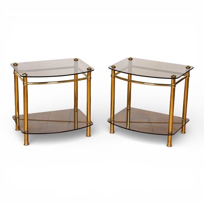 Lot 380 - A pair of brass and smoky glass two tier...