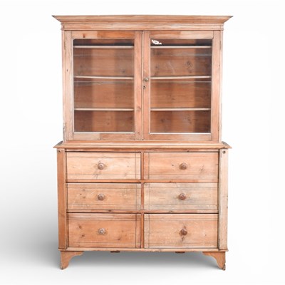 Lot 16 - An antique pine glazed cabinet, containing six...