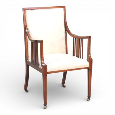 Lot 300 - An Edwardian cream upholstered armchair, on...
