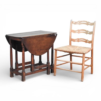 Lot 194 - An 18th century oak gateleg dining table,...