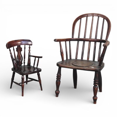 Lot 621 - A 19th century elm seated children's windsor...