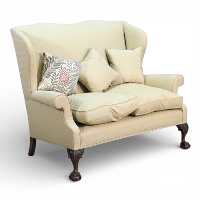 Lot 660 - A mid 20th century green upholstered wing back...