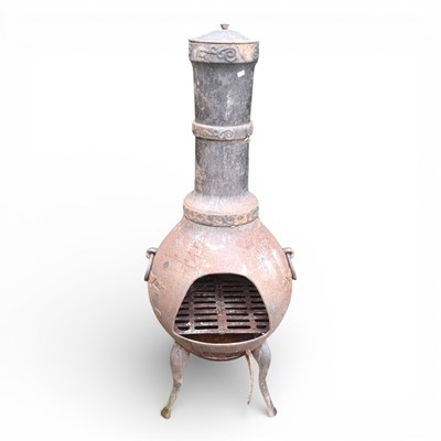 Lot 657 - A metal garden chiminea, 128cm high
