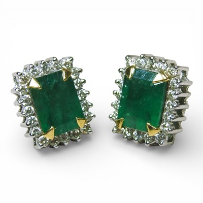 Lot 66 - A pair of 18 carat white gold cluster stud...