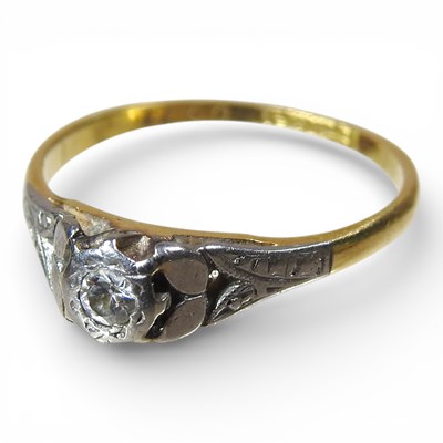 Lot 102 - An 18 carat gold and platinum set diamond ring,...