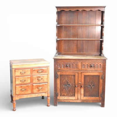 Lot 249 - An early 20th century walnut chest, containing...