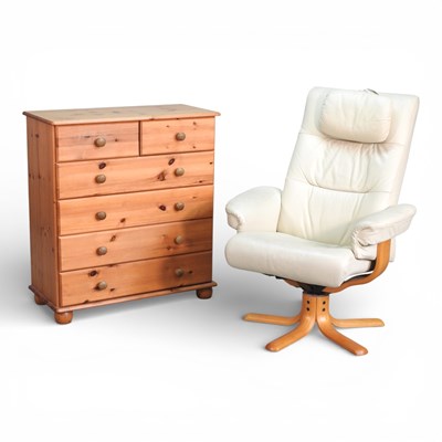 Lot 182 - A cream leather upholstered swivel reclining...