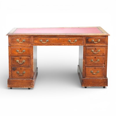 Lot 174 - An Edwardian twin pedestal desk, on a plinth base