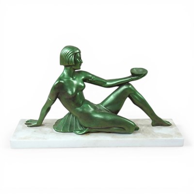Lot 318 - An Art Deco green painted figure of a seated...