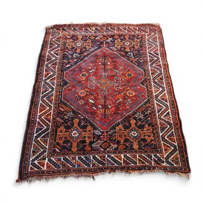 Lot 180 - A Hamadan rug, with a central hooked medallion,...