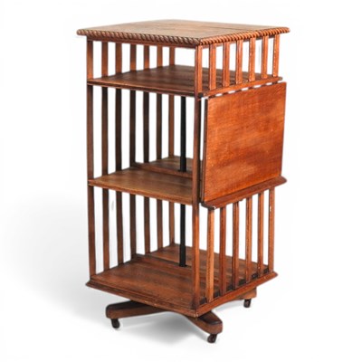 Lot 454 - A 1920s oak revolving bookcase, with a...
