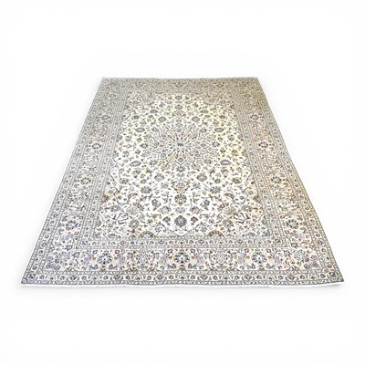 Lot 221 - A large Persian kashan carpet, with scrolling...