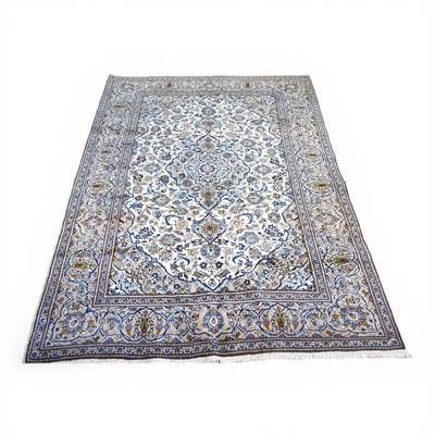 Lot 509 - A Persian kashan carpet, with scrolling...