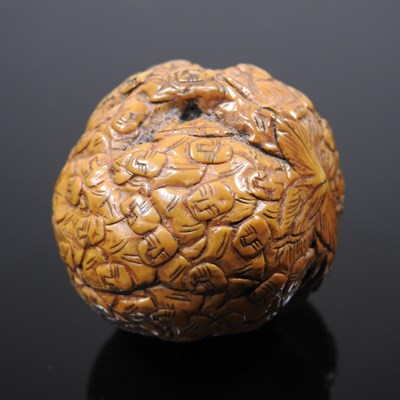 Lot 31 - A Chinese walnut, finely carved with intricate...