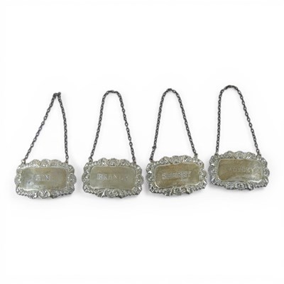 Lot 504 - A set of four modern silver decanter labels,...