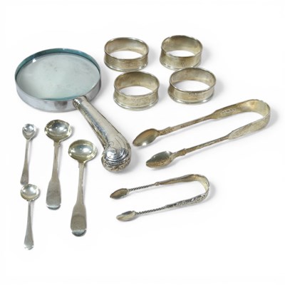 Lot 135 - A near set of four modern silver napkin rings,...